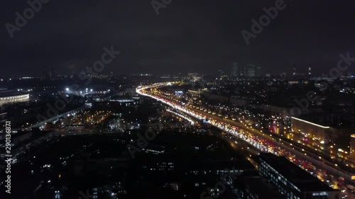 Wallpaper Mural A beautiful aerial view of a busy night city full of lights. Busy highway is shining with numerous headlights of hurrying cars. Countless buildings with glowing windows are going over horizon Torontodigital.ca