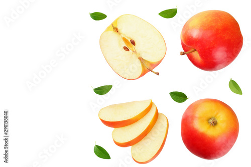 Fototapeta Naklejka Na Ścianę i Meble -  red apples with slices and green leaves isolated on a white background. top view