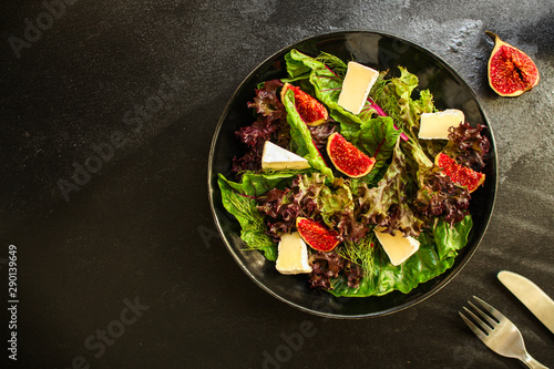 healthy salad from mix leaves, figs, cheese (tasty snack, vitamins, healthy food) menu concept. food background. copy space. Top view