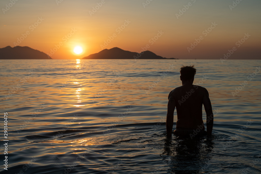 Swimming in sunrise