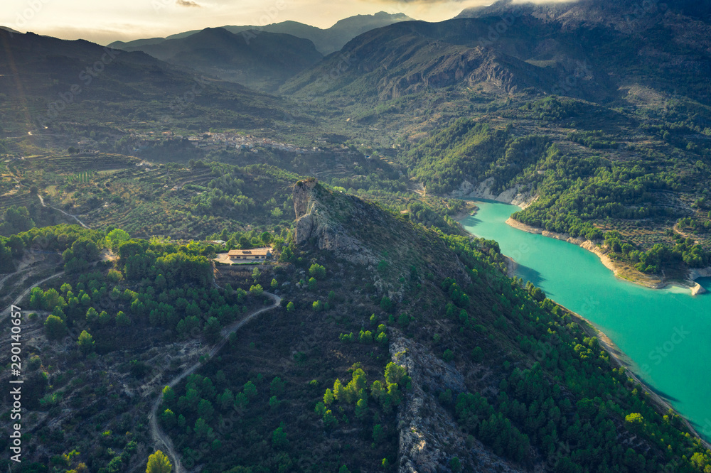 Aerial landscape shot of Guadalest Lake Valley Alicante Province Costa Blanca Spain at sunset