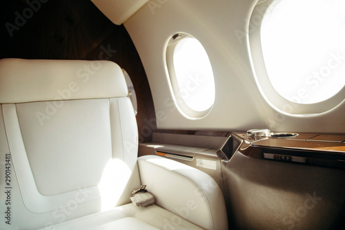 modern and comfortable interior of business jet aircraft with decor