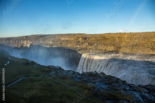 Overview of the largest waterfall in Europe called Dettifoss with a beautiful rainbow in Iceland