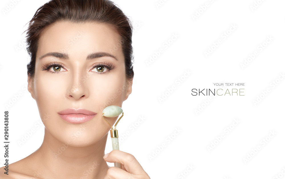 Beautiful spa model girl using jade face roller on her flawless fresh clean skin. Facial treatments Beautiful spa model girl using jade face roller on her flawless fresh clean skin. Facial treatments