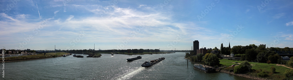 Panoramic view along the river Rhine in Duisburg Germany including industry and ship transport