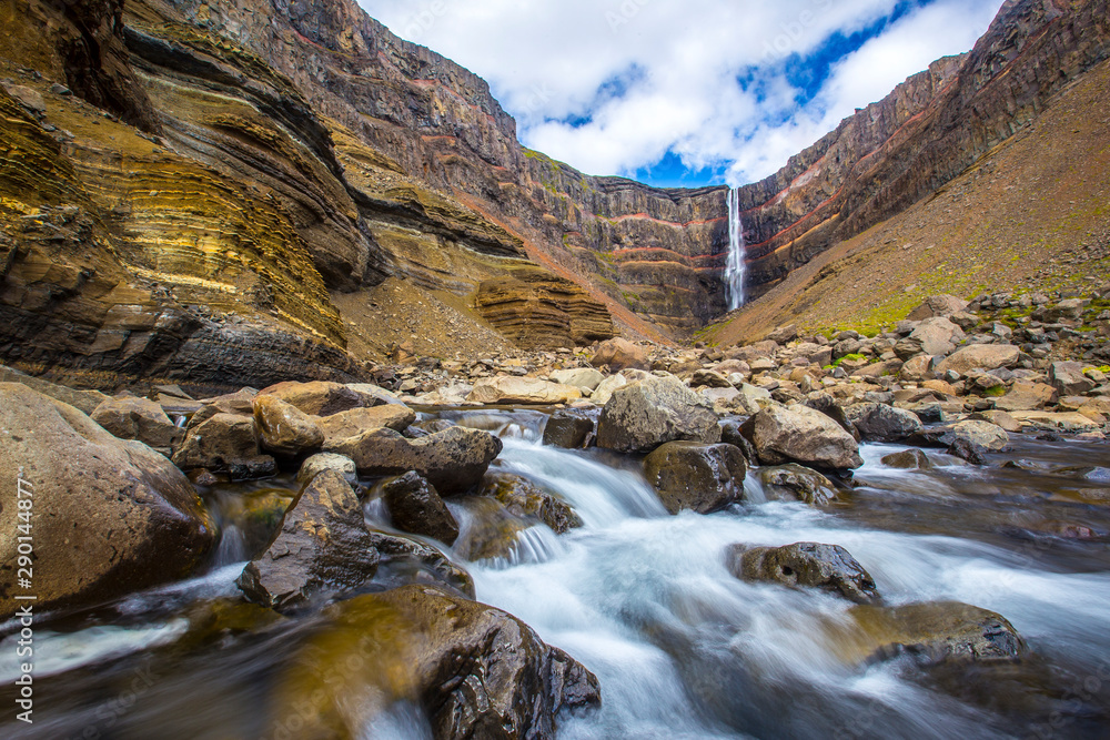 Hengifoss seen along the river in a long exposure photo. Iceland Hengifoss seen along the river in a long exposure photo. Iceland