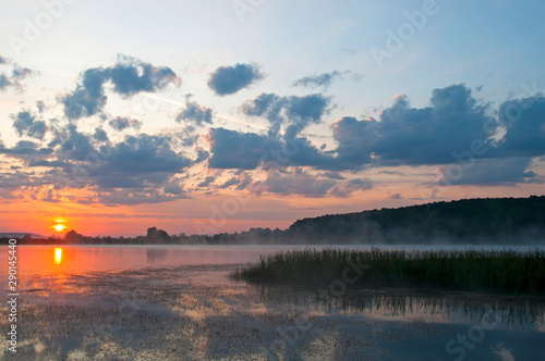 beautiful sunrise on the autumn lake © mikhailgrytsiv