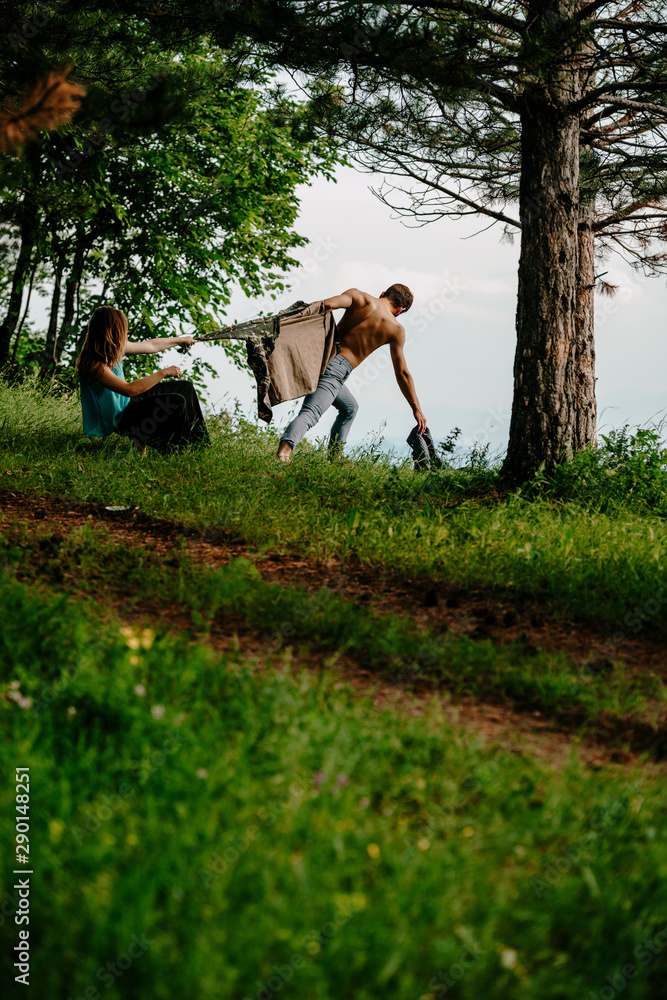 Carefree man in the woods practicing with an attractive colleague Carefree man in the woods practicing with an attractive colleague