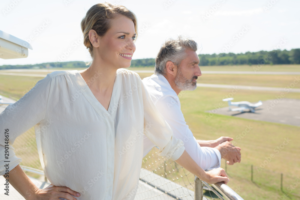 a business couple is outdoors