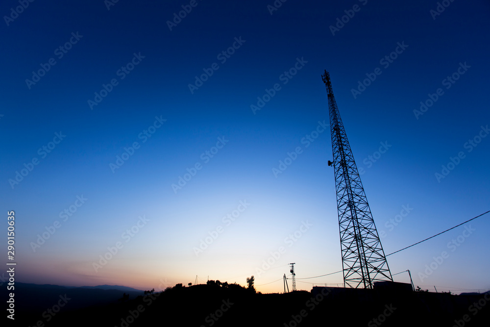 Close-up steel structure. communication antennas with blue sky background. communication antennas silhouetted against blue sky.