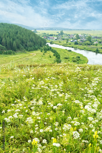 View of the river and the village against the sky photo