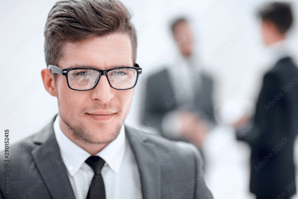 close up. the face of a young businessman in the office. close up. the face of a young businessman in the office.