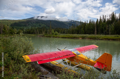 Seaplane docked at Mud Lake with Mountains in the background. Taken in Blue River, North of Kamloops, British Columbia, Canada. photo