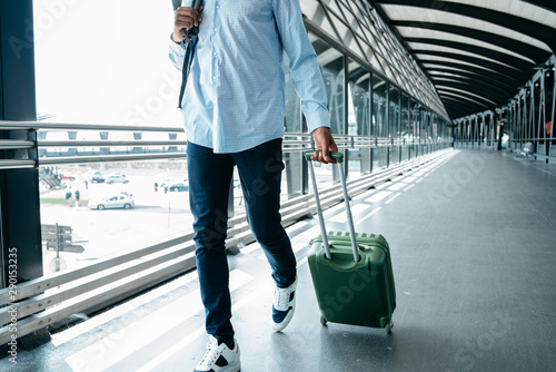 Man walking with suitcase at the airport