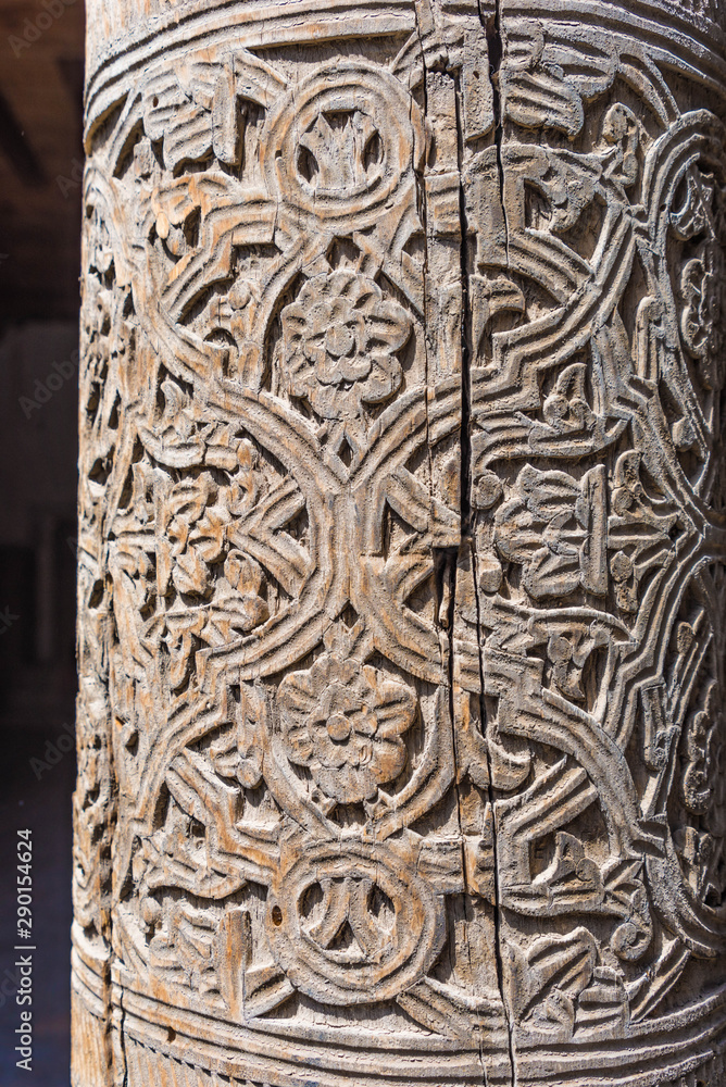 wooden pillar with carving, detail, friday mosque (juma mosque) in khiva, uzbekistan