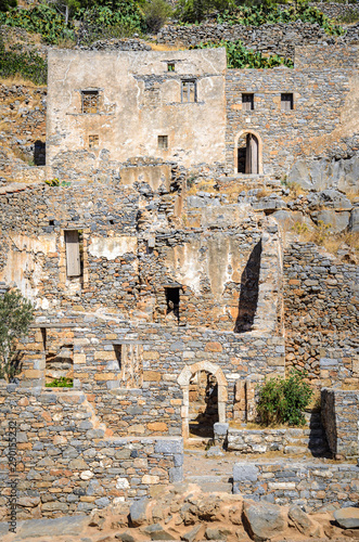 Ruins of old buildings in Spinalonga island of lepers in Crete, Greece photo