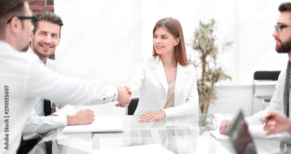 handshake business people in a modern office handshake business people in a modern office