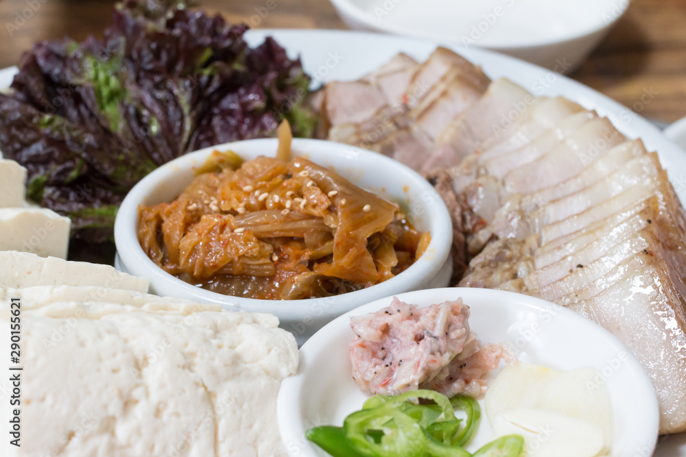 Korean traditional food bossam, boiled pork eaten with bossam kimchi Korean traditional food bossam, boiled pork eaten with bossam kimchi
