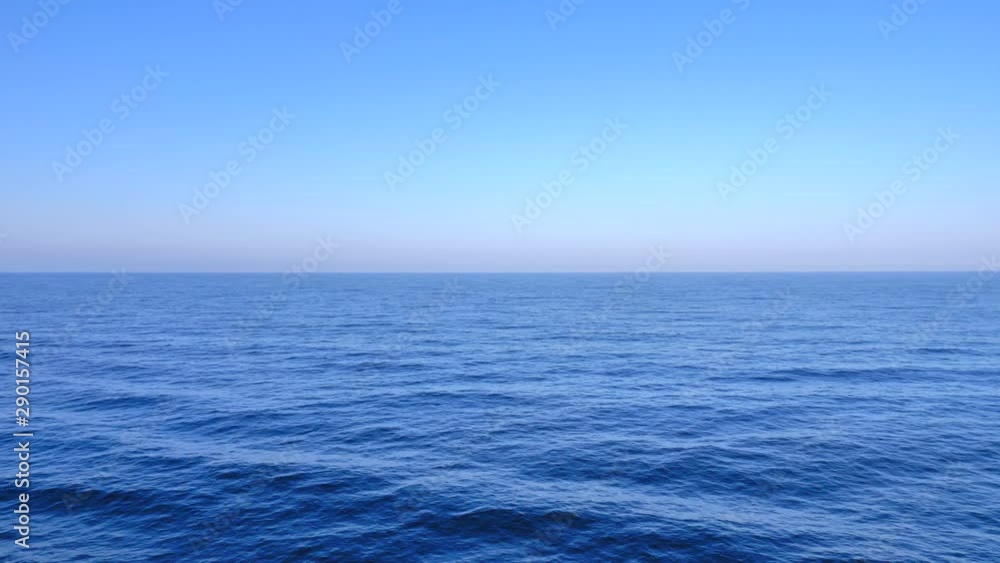 Deep Blue calm Ocean water with blue sky in the horizon, Early morning shot. Deep Blue calm Ocean water with blue sky in the horizon, Early morning shot.