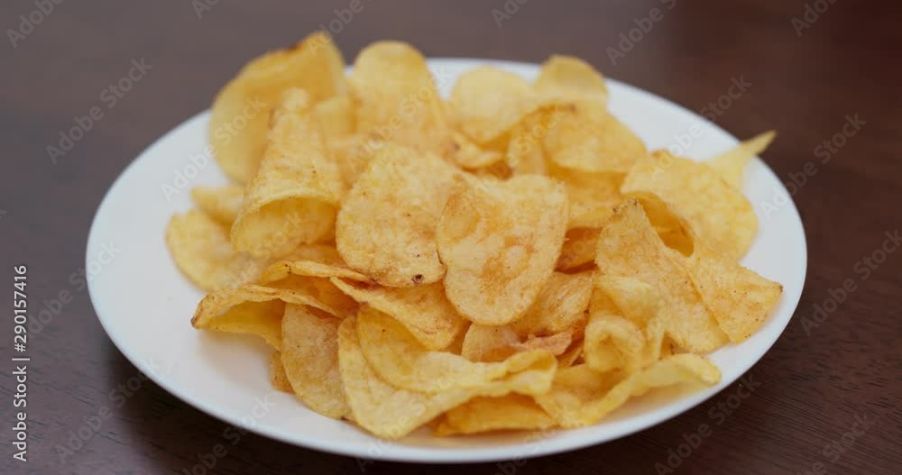 Potato chip on white plate, eat together Potato chip on white plate, eat together