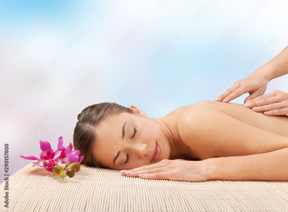 Beautiful young woman relaxing with massage at beauty spa Beautiful young woman relaxing with massage at beauty spa