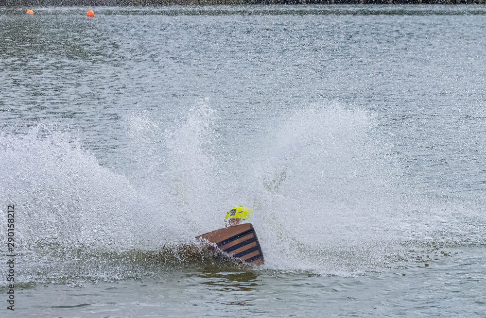Fototapeta premium Teenager wakeboarding on a lake - Brwinow, Masovia, Poland