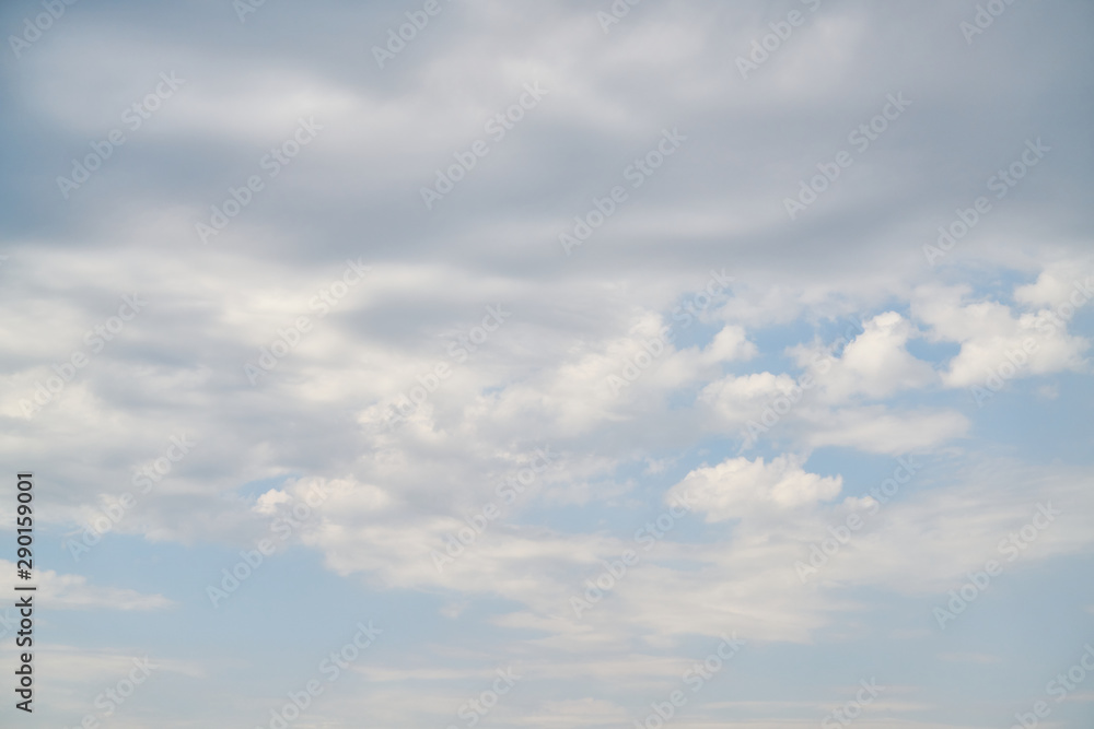 blue sky background with fluffy clouds.