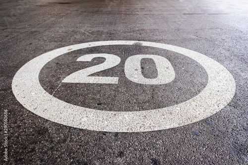 Mark on the ground at maximum speed at 20 miles per hour on the ground of a residential road.