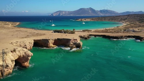 Aerial drone video of iconic caves of Xylobatis or Ksylompatis in Koufonisi island, Small Cyclades, Greece photo