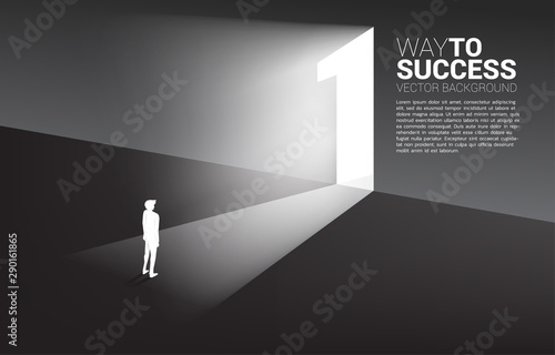 Silhouette of businessman standing in front of exit door number one. Concept of career start up and champion business solution.