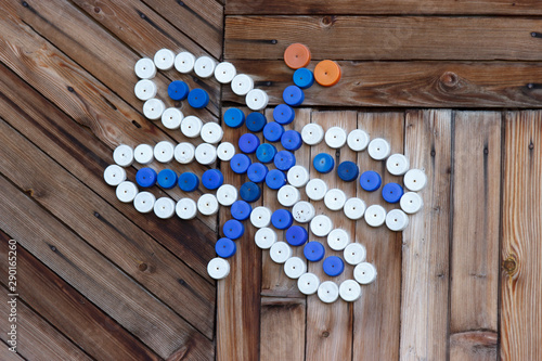butterfly decoration made of colorful plastic bottle caps .