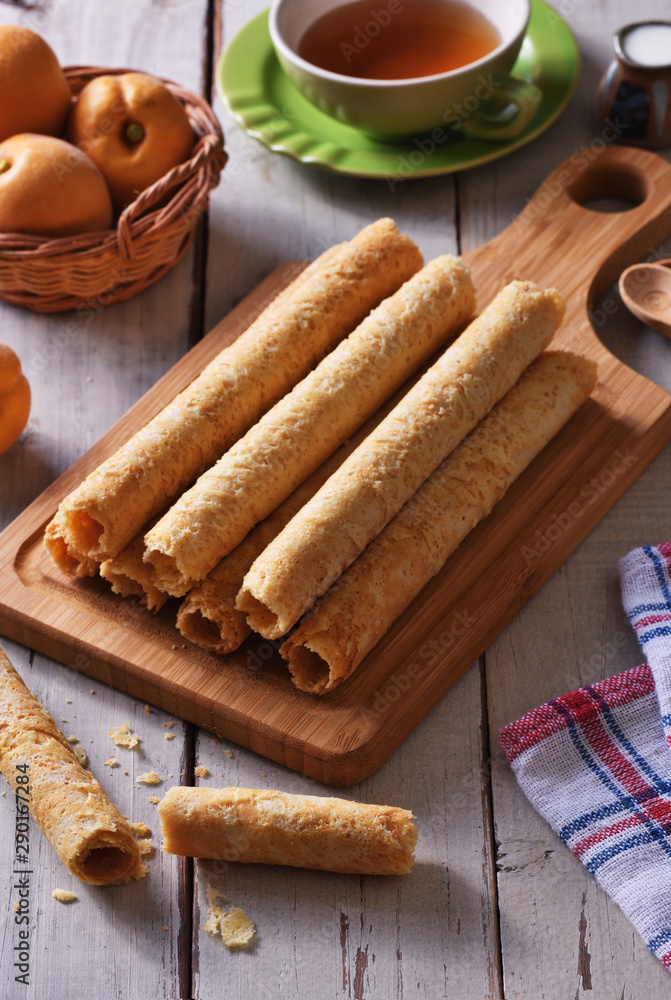 Handmade egg rolls on the wooden board Handmade egg rolls on the wooden board