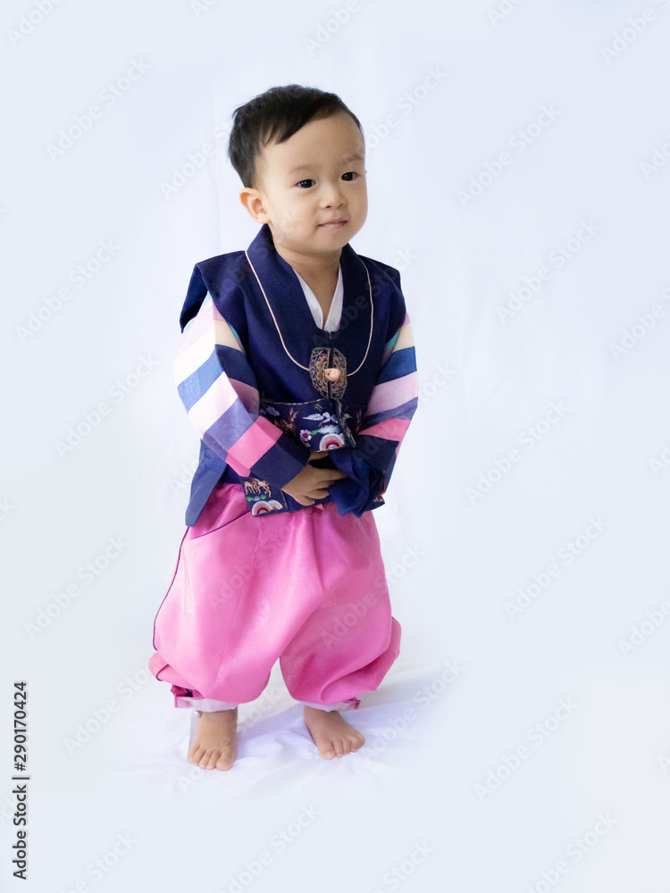 Baby boy wearing a Korean Traditional Hanbok dress in white background Baby boy wearing a Korean Traditional Hanbok dress in white background