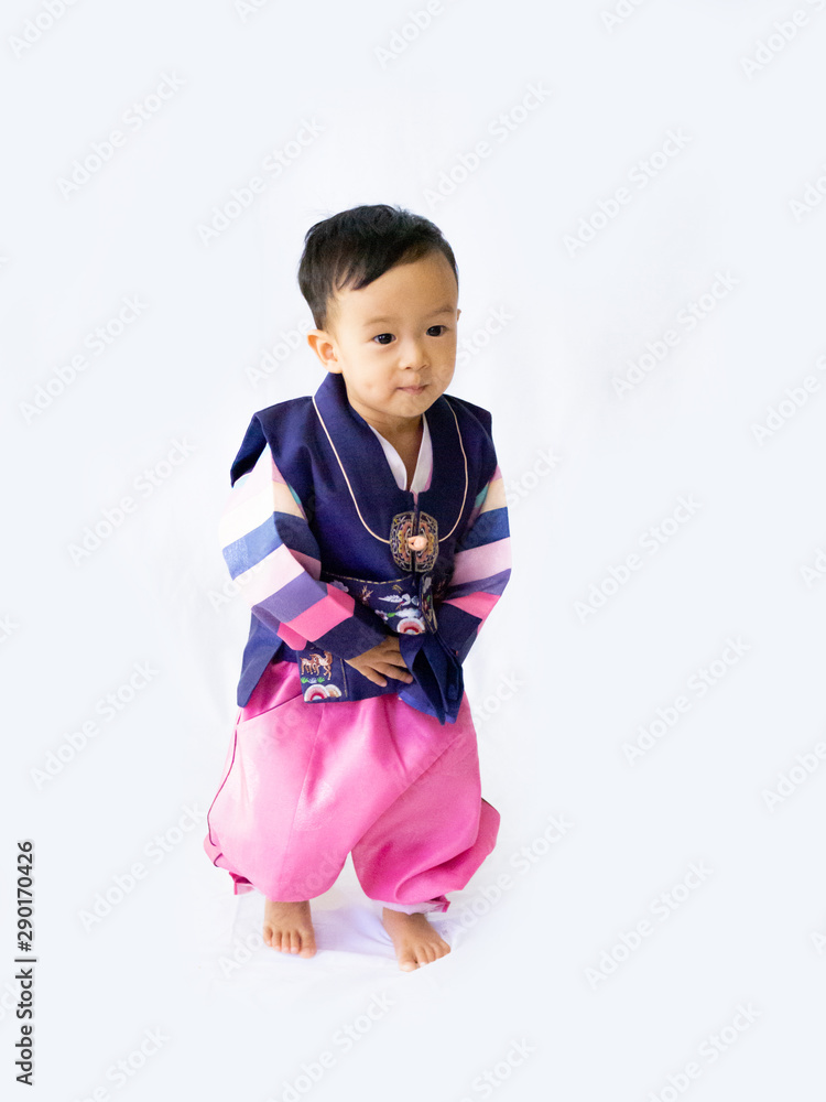 Baby boy wearing a Korean Traditional Hanbok dress in white background Baby boy wearing a Korean Traditional Hanbok dress in white background