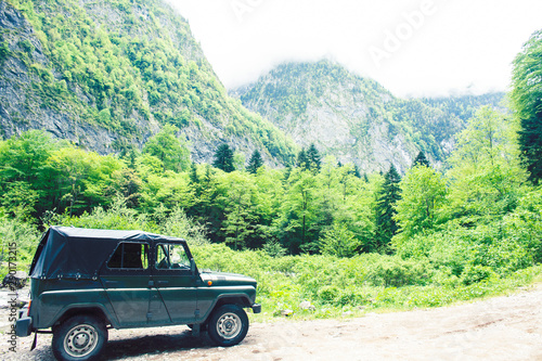 jeep on road hight in mountain, beautiful summer landscape with river