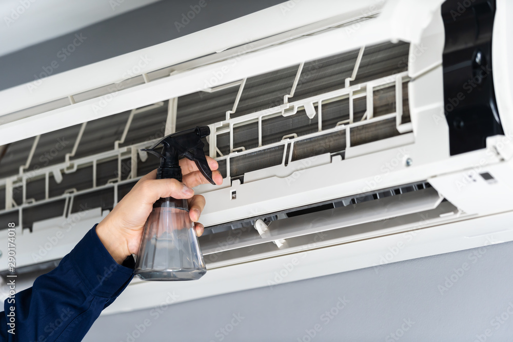 close up technician service cleaning the air conditioner close up technician service cleaning the air conditioner