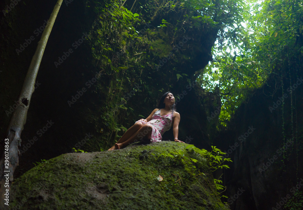 Naklejka premium beautiful dreamy portrait of5 young attractive and elegant Asian woman in Summer dress enjoying nature relaxed at dreamy and unique green forest feeling magical