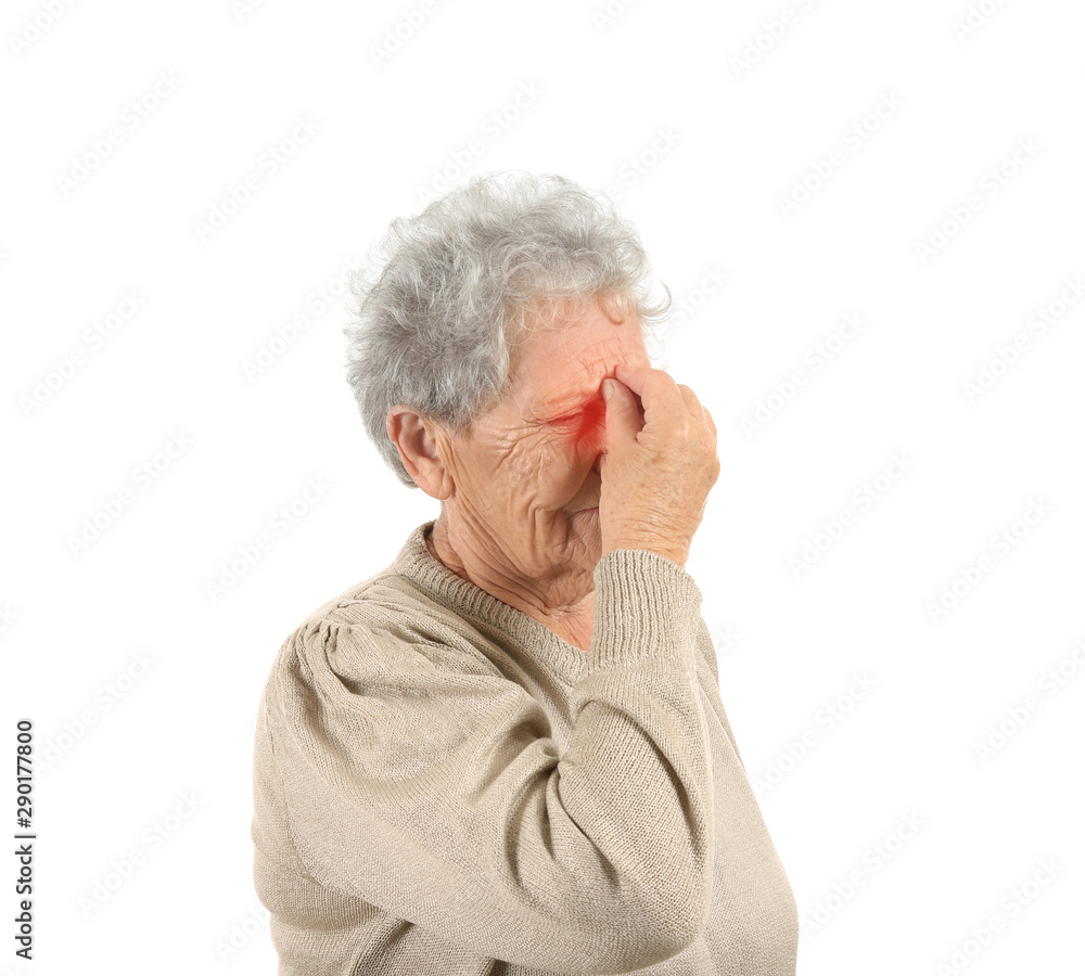 Senior woman suffering from headache on white background Senior woman suffering from headache on white background