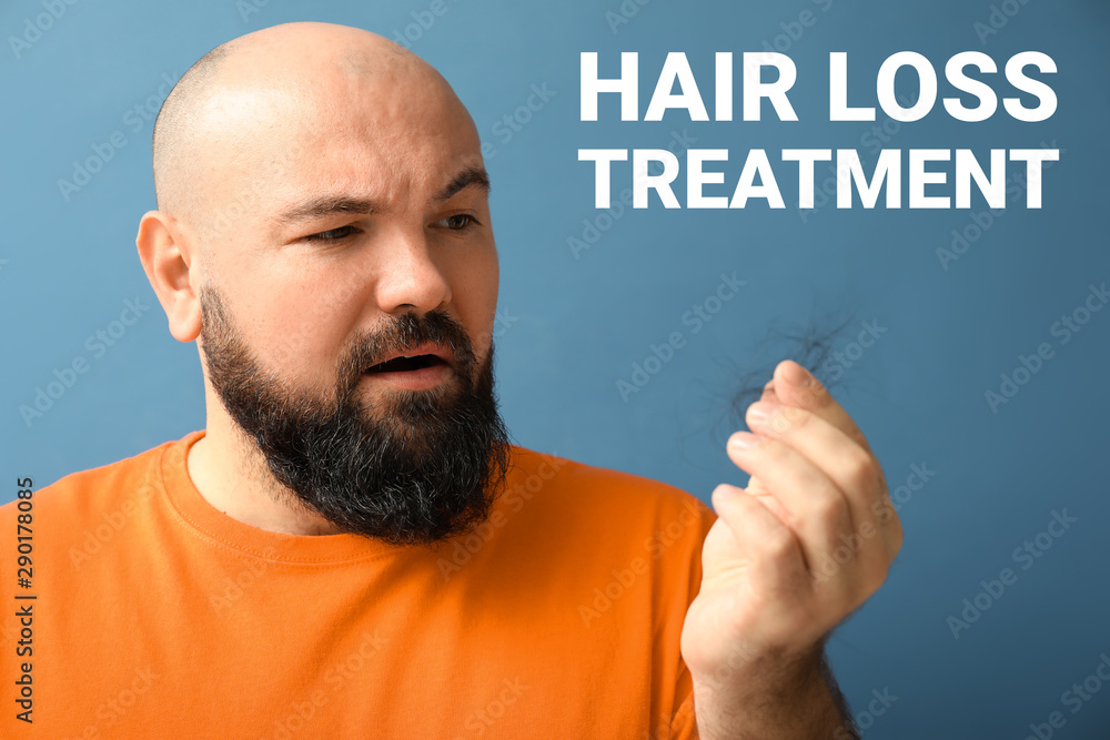 Man with hair loss problem on color background Man with hair loss problem on color background