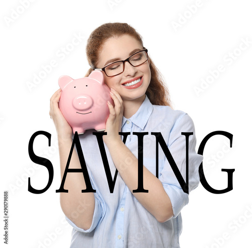 Young woman holding piggy b...