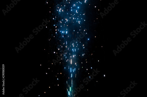Sparks sparkling into the night sky, blending overlay
