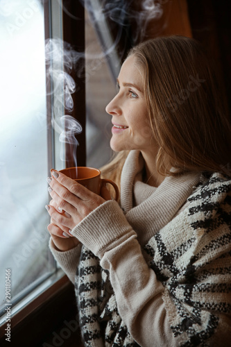 Young woman with hot drink ...