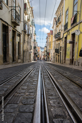Famous street of Lisbon named Rua da Bica with the beatiful view of the horizon