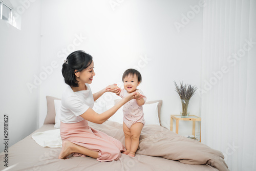 Cute little girl sitting in a room. Child have fun at home.