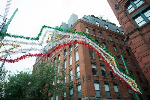 The Feast of San Gennaro a famous italian festival in little italy near chinatown new york. Sign in Green white and red. photo