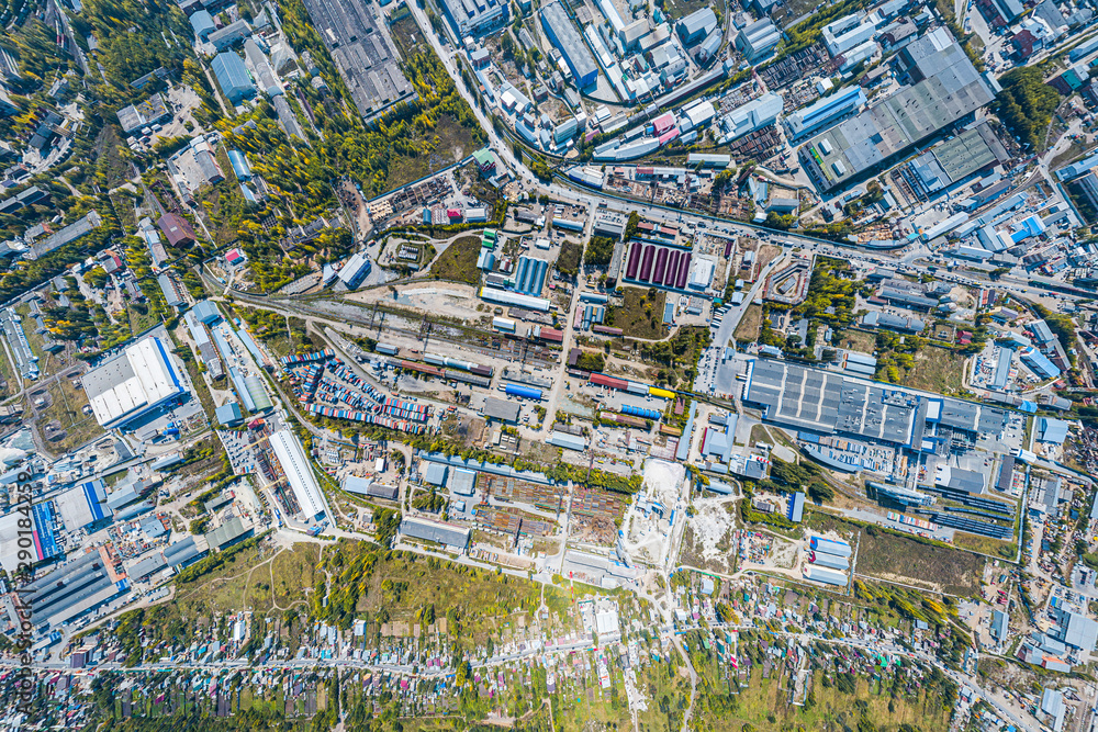 Top view of the industrial zone: garages, warehouses, containers for storing goods. The concept of storage of goods by importers, exporters, wholesalers, transport enterprises, customs Top view of the industrial zone: garages, warehouses, containers for storing goods. The concept of storage of goods by importers, exporters, wholesalers, transport enterprises, customs