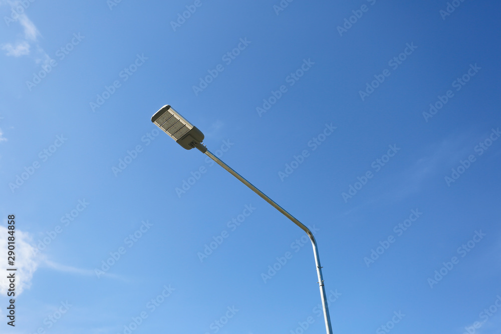 Light pole on blue sky background.