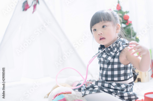 Merry christmas happy little child with beautifully decorated christmas tree holidays in home, christmas concept