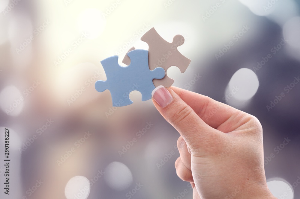 Hand holding puzzle. Hand holding puzzle.