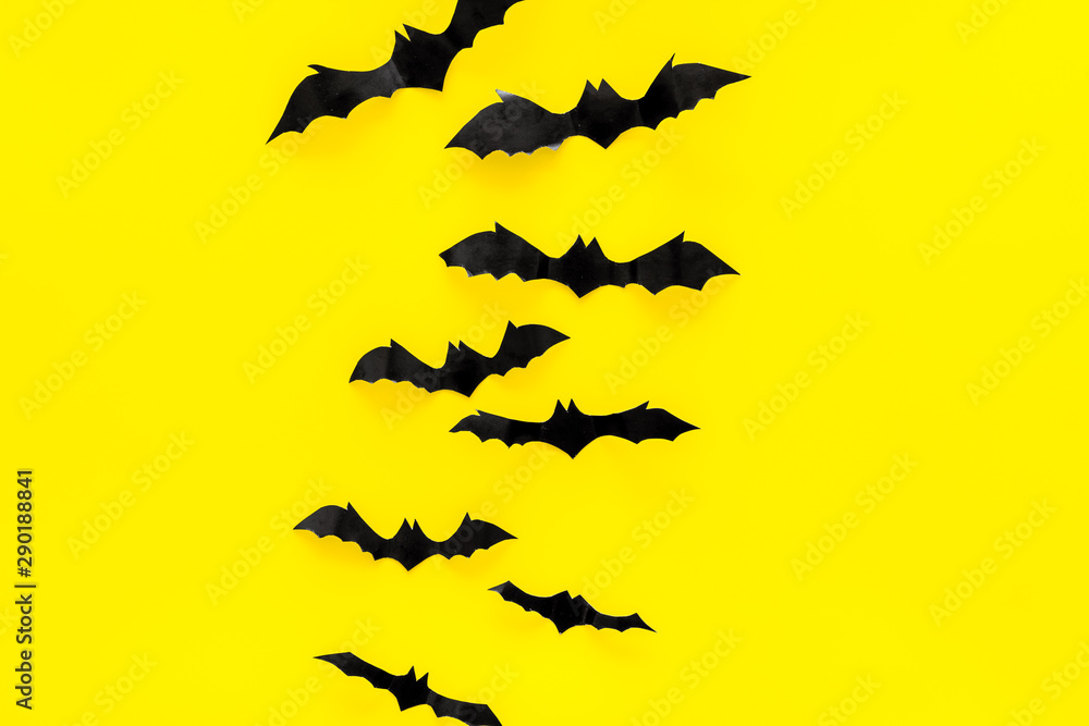 Fototapeta premium Halloween design. Bats on yellow background top view space for text